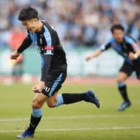 Frontale\'s Shogo Taniguchi celebrates after scoring a first-half goal against Reysol on Saturday at Todoroki Stadium. Kawasaki beat Kashiwa 3-0. | KYODO