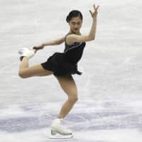 Satoko Miyahara performs during the women\'s free skate at Hiroshima Green Arena. Miyahara placed second with 219.47 points. | AP