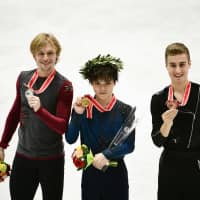 Silver medalist Sergei Voronov of Russia (left), winner Shoma Uno (center) and Italy\'s bronze medalist Matteo Rizzo display their medals after the men\'s free skate at the NHK Trophy. | AFP-JIJI