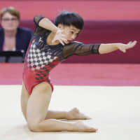 Gymnast Mai Murakami performs her floor routine on Saturday at the world championships in Doha. | KYODO