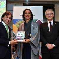 Takanori Nakamura (center) receives a plaque for his appointment as &#34;Ambassador of the Best of Colombia&#34; from Hiroshi Wago Rojas, executive director of ProColombia Japan (left), and Gabriel Duque, Colombian ambassador to Japan (right), during a ceremony at the ambassador\'s residence on Nov. 7. | YOSHIAKI MIURA