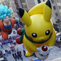 Huge balloons in the form of Pikachu, a  \"Pokemon\" character, and Goku, from the \"Dragon Ball\" series, float above spectators on 6th Avenue during the 92nd Macy\'s Thanksgiving Day Parade in New York City on Thursday. A cold snap failed to cool the enthusiasm of crowds at the event. | REUTERS