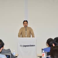 Economist Kosuke Motani gives a keynote speech at a symposium co-hosted by the Japan Times Satoyama Consortium in Jinsekikogen, Hiroshima Prefecture, on Oct. 20. | SHINOBU YAMADA