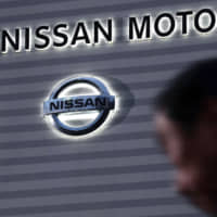 Greg Kelly, a former Nissan Motor Co. representative director who was first arrested on Nov. 19, was served a fresh arrest warrant along with former Chairman Carlos Ghosn on Monday. | KYODO