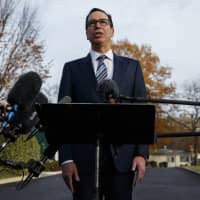 Treasury Secretary Steve Mnuchin talks with reporters at the White House in Washington Dec. 3. Trump says he has confidence in Mnuchin, calling him a \"very talented guy\" and a \"very smart person.\" | AP