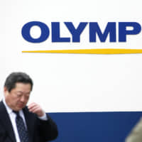 Olympus Corp. has acknowledged in a settlement that it did not report three separate cases of infections, including E. coli bacteria, to the U.S. Food and Drug Administration. | BLOOMBERG