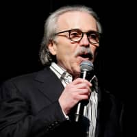 David Pecker, chairman and CEO of American Media, speaks at the Shape and Men\'s Fitness Super Bowl Party in New York City in 2014. | REUTERS