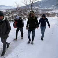 Migrants attempt to illegally cross the border into Croatia on the Pljesevica Mountain near Bihac, Bosnia and Herzegovina, Thursday. | REUTERS