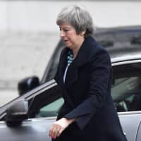 British Prime Minister Theresa May returns to No. 10 Downing St. in London on Monday. | REUTERS