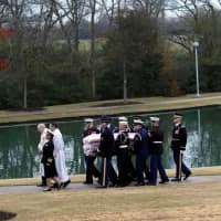 The casket of former President George H.W. Bush is carried by a joint services military honor guard for burial at the George H.W. Bush Presidential Library and Museum on Thursday in College Station, Texas. | REUTERS