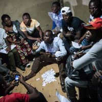 Improvised electoral agents count ballots after a symbolic vote Sunday at Kalinda Stadium in Beni, where voting was postponed for Democratic Republic of Congo\'s general elections. | AFP-JIJI