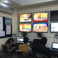 Congress party volunteers monitor TV news channels and social media platforms inside an operations room in Jaipur on Dec. 3 ahead of a Rajasthan state assembly election. | REUTERS
