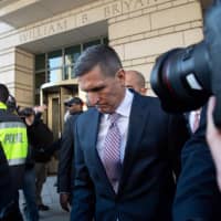 Former National Security Advisor Gen. Michael Flynn leaves after the delay in his sentencing hearing at U.S. District Court in Washington Tuesday. President Donald Trump\'s former national security chief Flynn received a postponement of his sentencing after an angry judge threatened to give him a stiff sentence. | AFP-JIJI
