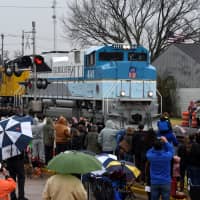 Spectators watch as the Union Pacific funeral train carrying the casket of former President George H.W. Bush passes through Navasota, Texas, Thursday. | REUTERS