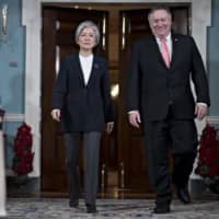U.S. Secretary of State Mike Pompeo and South Korean Foreign Minister Kang Kyung-wha walk out for a photo opportunity at the State Department in Washington on Thursday. | BLOOMBERG