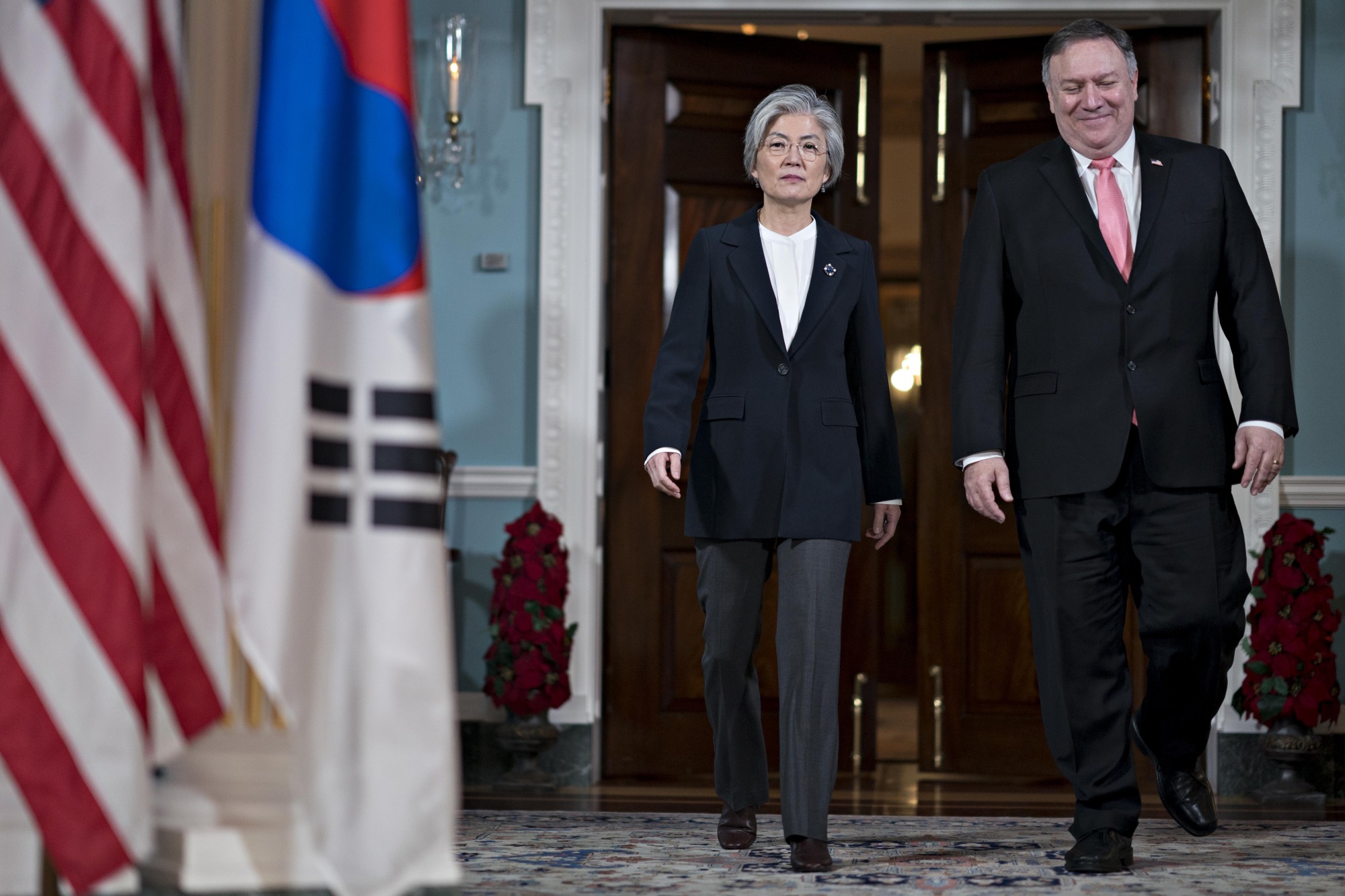 U.S. Secretary of State Mike Pompeo and South Korean Foreign Minister Kang Kyung-wha walk out for a photo opportunity at the State Department in Washington on Thursday. | BLOOMBERG