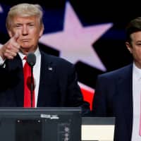 Then-Republican presidential nominee Donald Trump gives a thumbs up as his campaign manager, Paul Manafort, looks on during Trump\'s walk-through at the Republican National Convention in Cleveland in 2016. | REUTERS