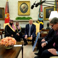 U.S. President Donald Trump, flanked by Energy Secretary Rick Perry (right), delivers remarks as he welcomes Saudi  Crown Prince Mohammed bin Salman in the Oval Office at the White House in Washington in March. | REUTERS