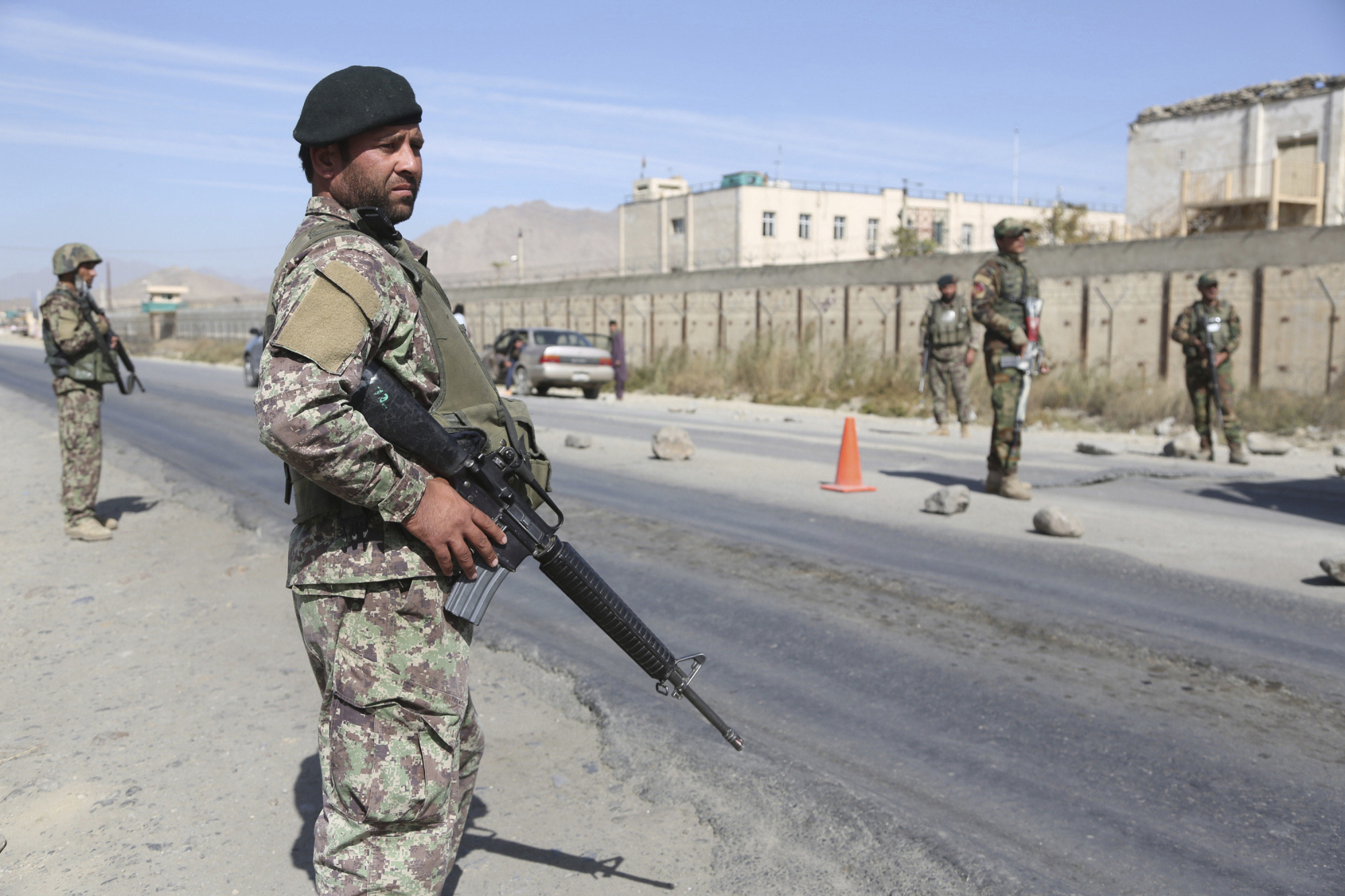 Afghan soldiers stand guard at a checkpoint in Kabul on Oct. 17. | AP