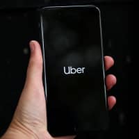 Firms like Uber, best-known for its ride-hailing service, have been criticized for hiring workers on a self-employed basis, which means they are not entitled to many workplace rights, including the minimum wage. | REUTERS