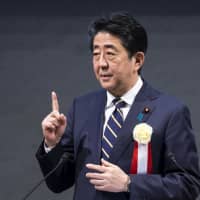 Prime Minister Shinzo Abe said Sunday he hopes to have a \"specific discussion\" with Russian President Vladimir Putin on a peace treaty between the two countries. | BLOOMBERG