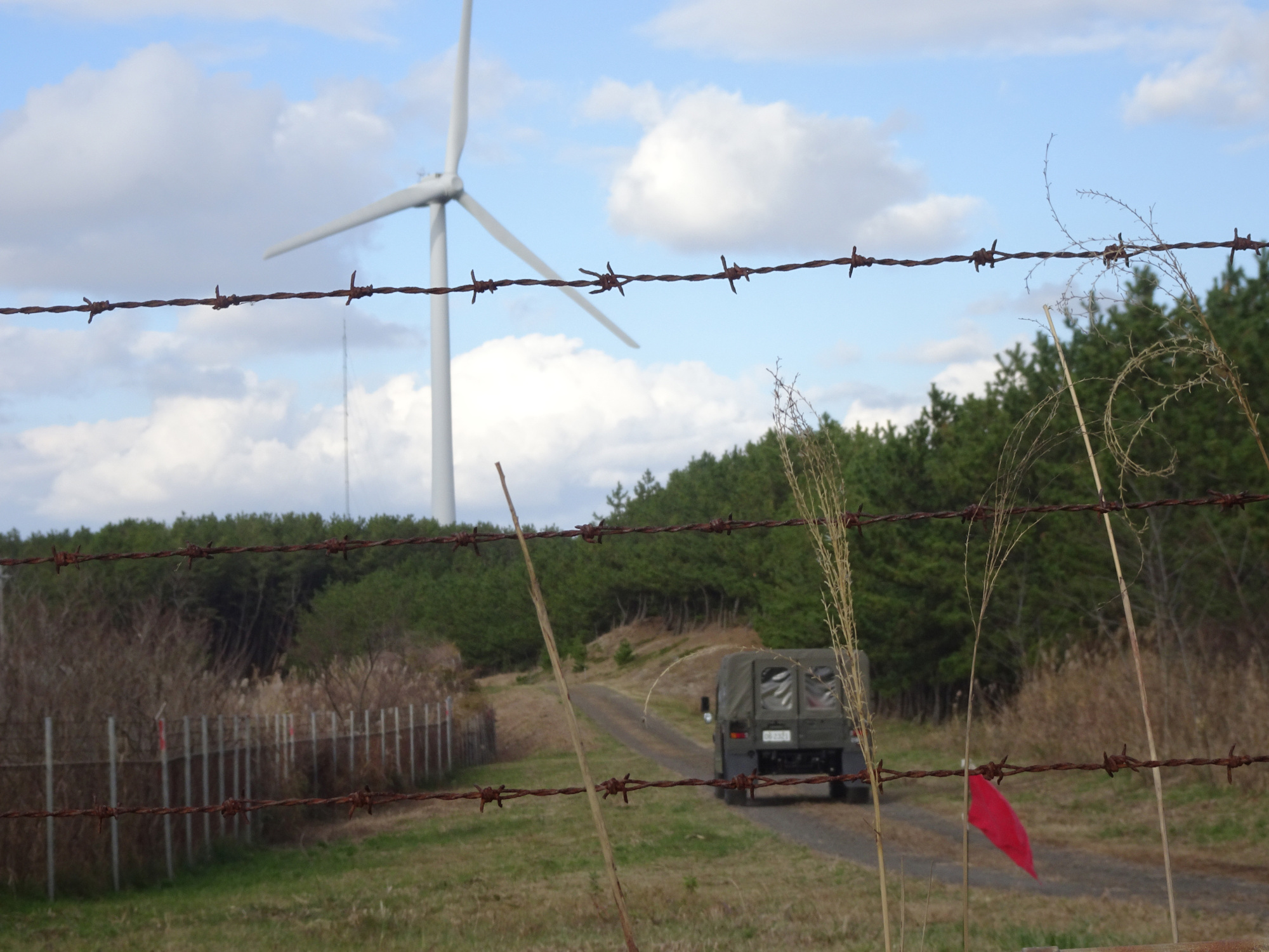Barbed wire lines the main entrance to the Ground Self-Defense Force's Araya training area in the city of Akita. | ERIC JOHNSTON
