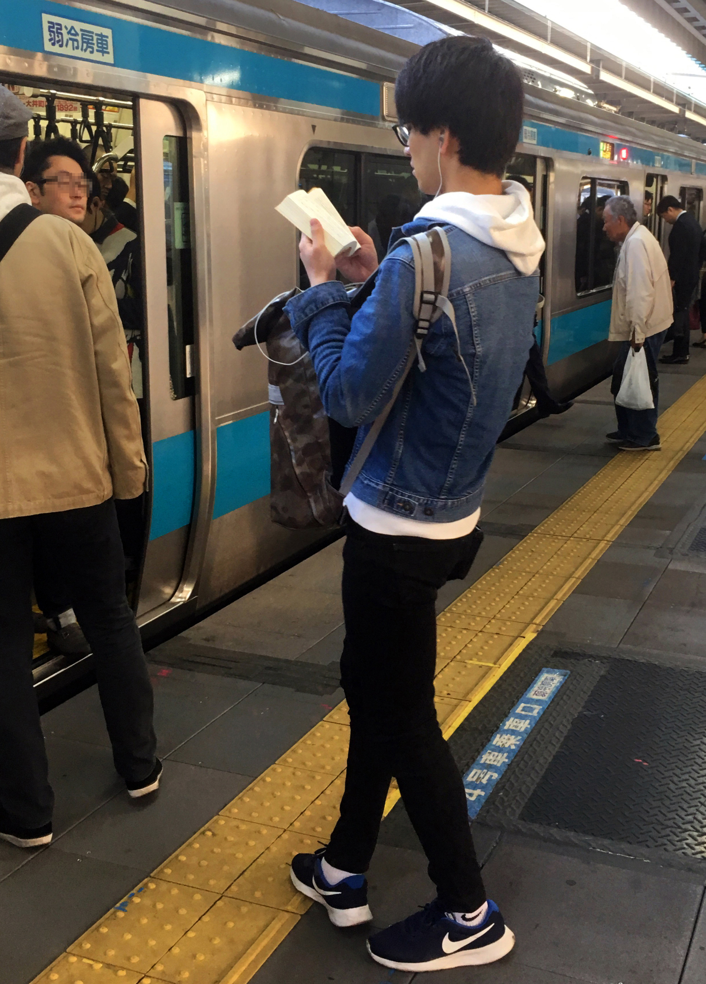 By design for manners or security backpacks increasingly being worn on the front in Japan The Japan Times