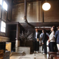 A kitchen in an old Japanese-style house in Sasayama, Hyogo Prefecture, is refurbished to function as a lobby after the vacant property was turned into a hotel. | CHUNICHI SHIMBUN