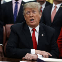 U.S. President Donald Trump makes a statement on the possible government shutdown before signing criminal justice reform legislation in the Oval Office at the White House in Washington on Friday. | AP