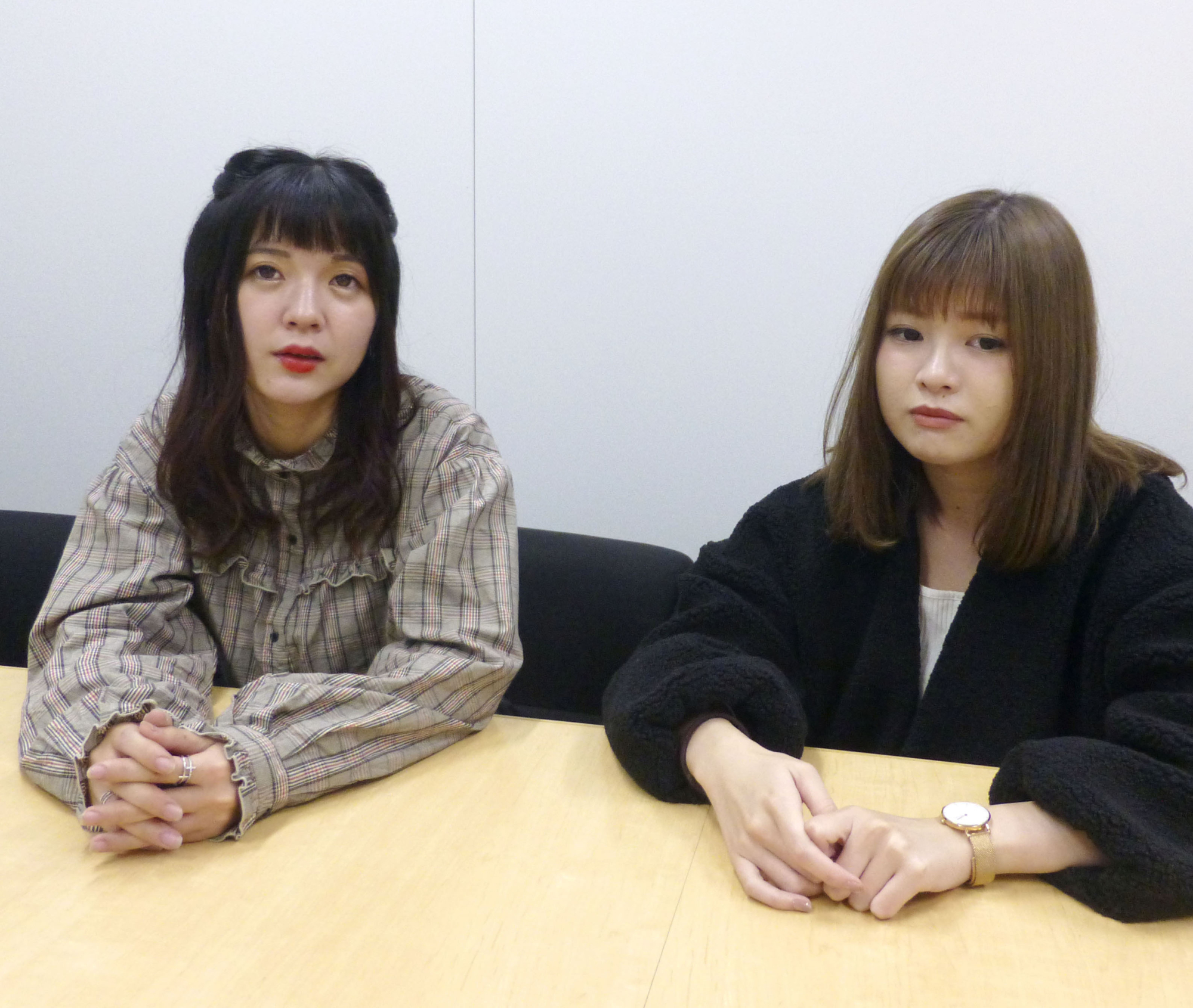 Aya Kotobano (left) and Natsumi Ogi, former members of the chika idol group Nijiiro Fanfare, are interviewed in Tokyo on Oct. 23. | KYODO