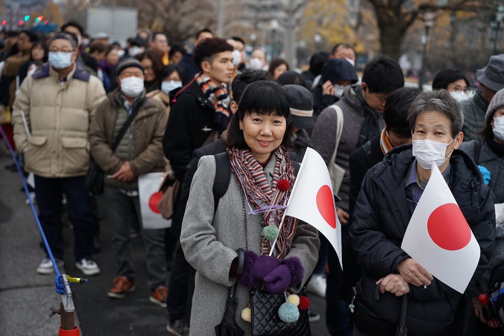Thousands of people lined up to witness the celebration of Emperor Akihito