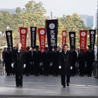 Members of the Imperial Guard led the way as people were allowed into the palace grounds. | RYUSEI TAKAHASHI