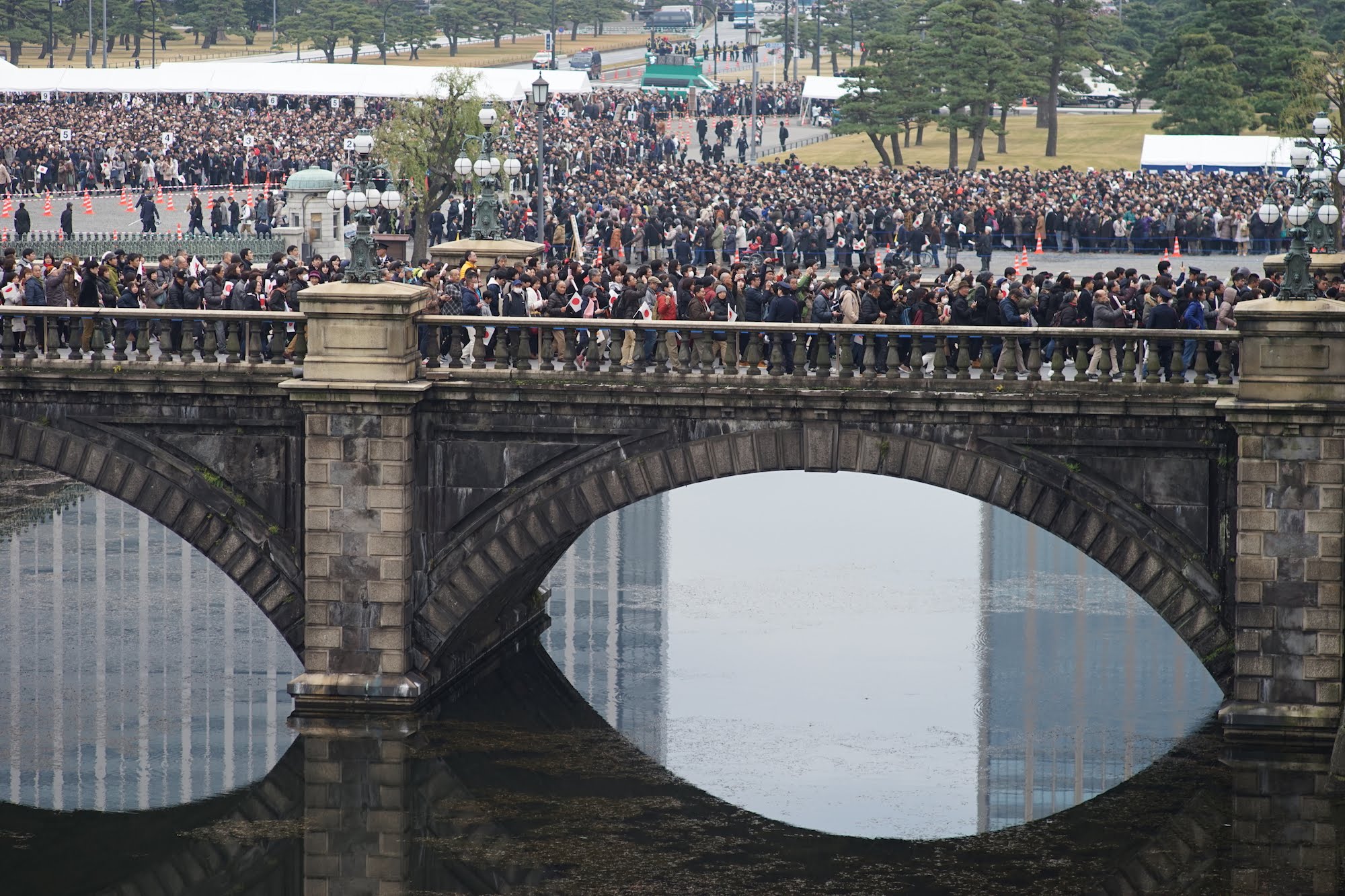 Crowds line up the enter the Imperial Palace grounds on Sunday.