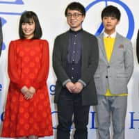 Film director Makoto Shinkai (center), best known for directing \"Kimi no Na wa\" (\"Your Name.\") &#8212; one of the highest-grossing Japanese films &#8212; stands alongside actor Kotaro Daigo and actress Nana Mori at a news conference in Tokyo on Thursday. Shinkai said his next anime film, \"Tenki no Ko\" (\"Weathering With You\"), will be released in July 2019. | KYODO