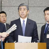 Defense Minister Takeshi Iwaya speaks during a news conference on Friday night. | KYODO