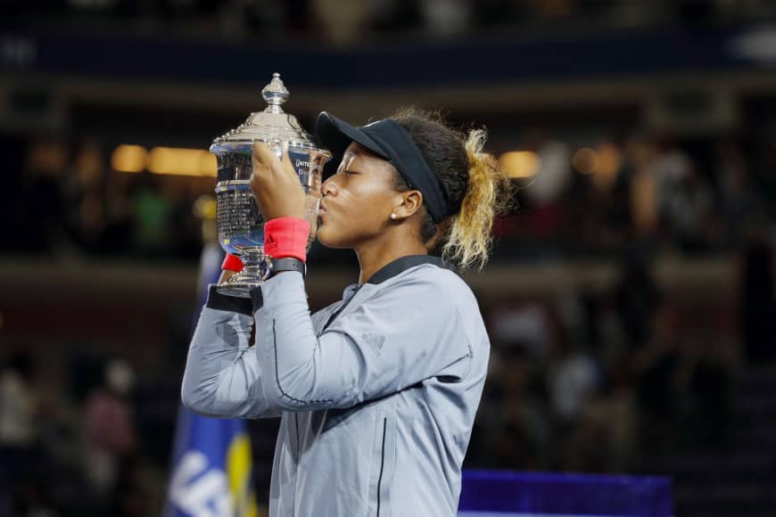 Naomi Osaka kisses the trophy after winning at the U.S. Open in New York in September.