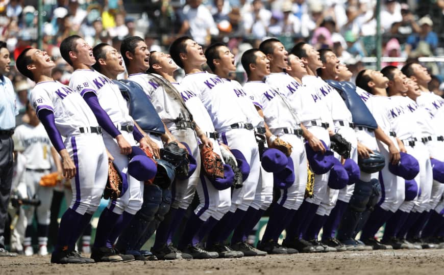 Members of Kanaashi Nogyo bend backward while singing their school anthem after winning a game at the National High School Baseball Championship at Koshien Stadium in August.