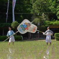 Fair harvest: Giant fans are used as part of a rice planting ritual at Sarutahiko Shrine. | STEPHEN MANSFIELD