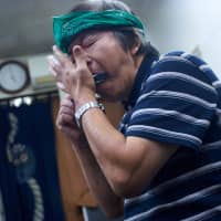 The Ramen Bluesman: Hisao Tanaka jams on a harmonica. | ROSS RANDLES