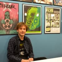 Cult classics: Pop! Pizza owner-chef Daniel McNellie sits in his pop culture-themed pizzeria in Kyoto. | J.J. O\'DONOGHUE