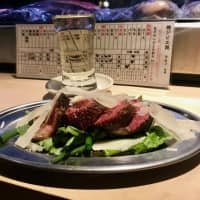 Lowbrow gourmet reward: Aged venison served atop salad greens with shaved Parmesan. | ROBBIE SWINNERTON