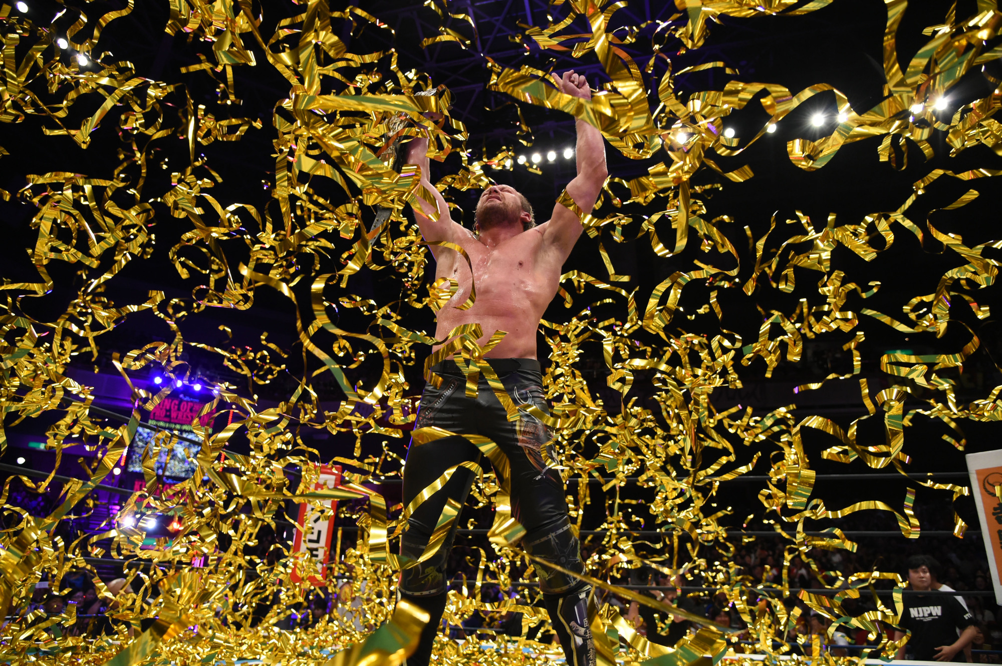 Kenny Omega celebrates after winning a fight at Tokyo