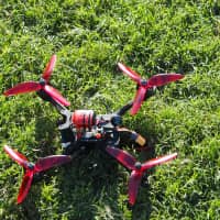 Pit stop: A drone comes to rest after a race during the final round of the Japan Drone League\'s 2018 season at Resol Seimei no Mori in Chiba Prefecture in October. | MARK THOMPSON