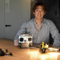 Drone racer Junichi Goto poses for a photograph at The Japan Times\' head office in Tokyo\'s Kojimachi district in October. | YOSHIAKI MIURA
