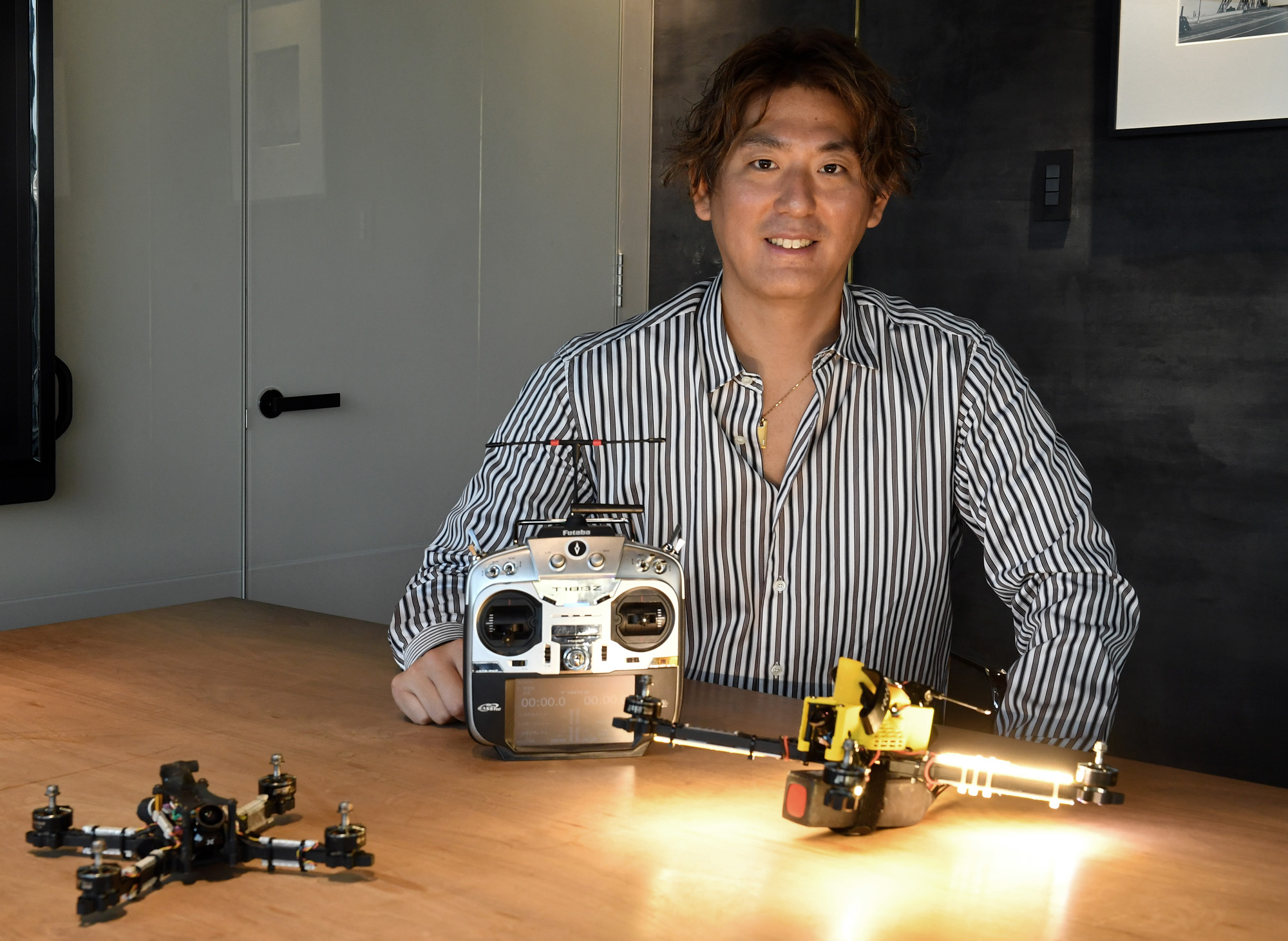 Drone racer Junichi Goto poses for a photograph at The Japan Times