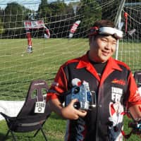 Japan Drone League\'s 2018 overall champion, Takafumi Oka, smiles after a race in October. | MARK THOMPSON