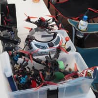 Drones await maintenance at the Japan Drone League event in Chiba Prefecture in October. | MARK THOMPSON