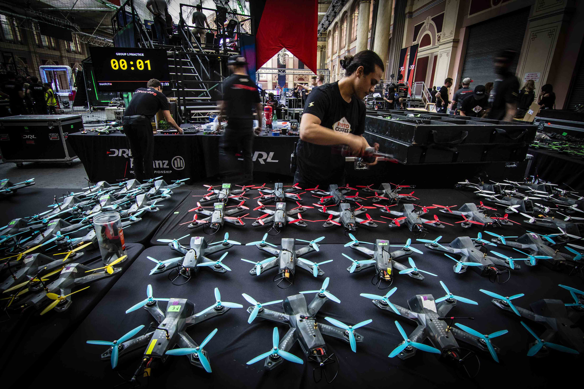 Drone Racing League officials check equipment at one of the organization
