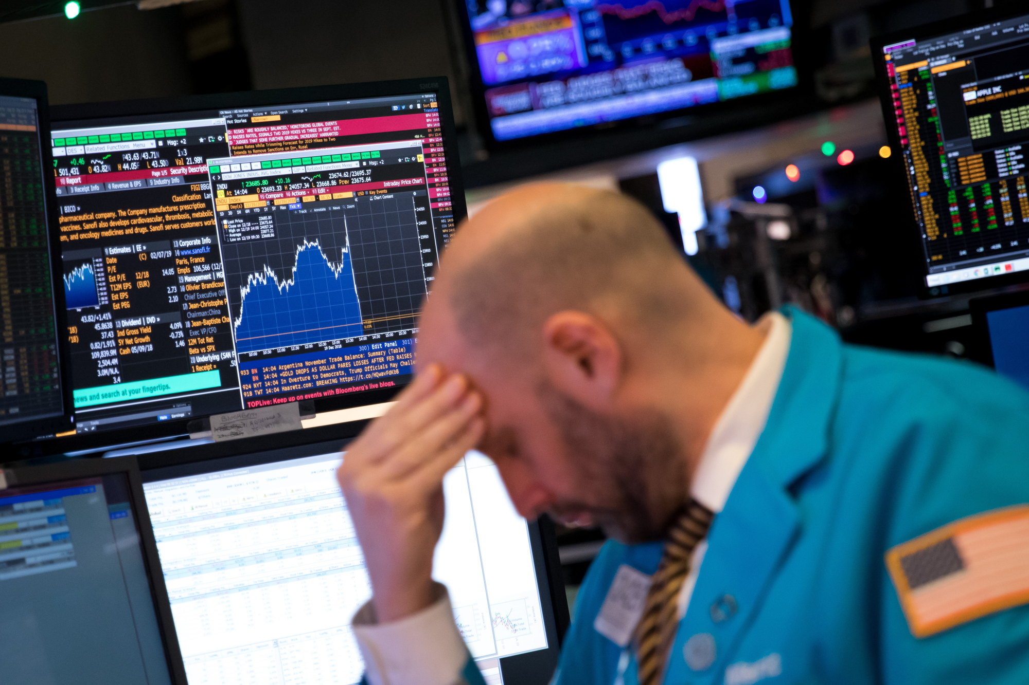 A trader works on the floor of the New York Stock Exchange on Dec. 19 as U.S. stocks careened to a 15-month low amid worries over the Federal Reserve's monetary policy. | BLOOMBERG