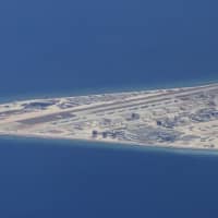 An airstrip and other structures are seen on China\'s man-made Subi Reef in the South China Sea\'s Spratly chain of islands on April 21, 2017. China has built seven islands in the Spratlys. | AP